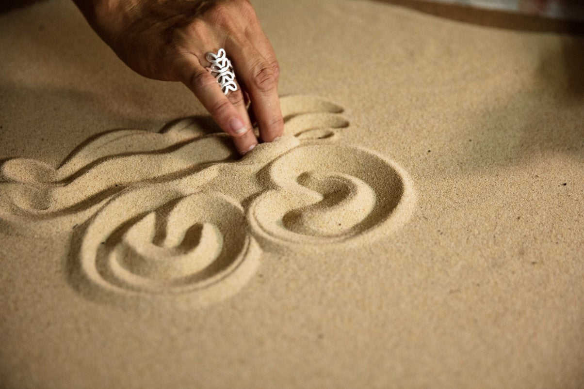 Saretta playing in sand